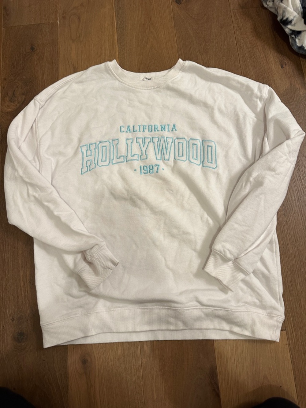 Garage White Crewneck Sweatshirt with Light Blue 'Hollywood' Graphic